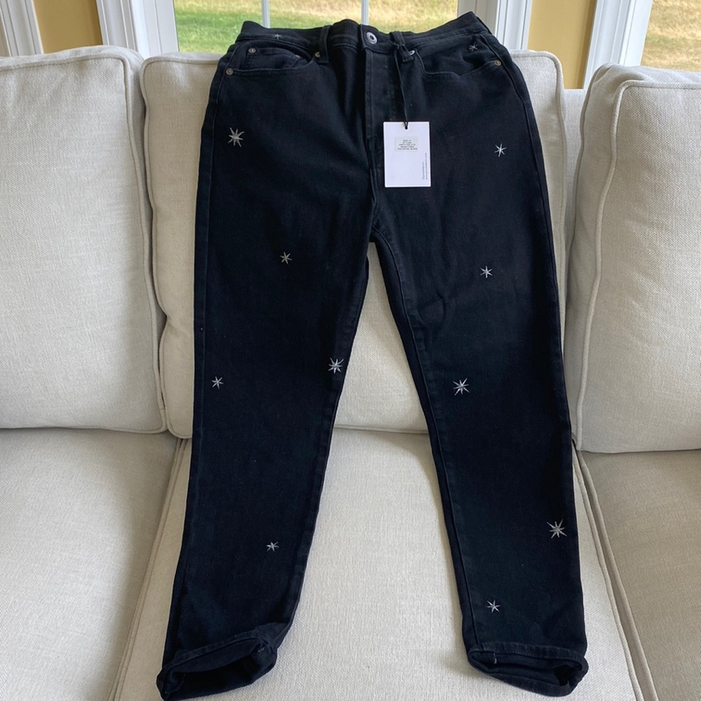 Women’s high rise button fly jeans with embroidered stats